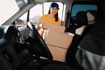 Poster - Courier taking parcel from car. Delivery service