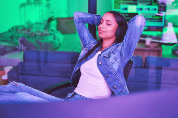 Leinwandbilder - Woman, headphones or relax in neon house after technology coding, software development or cybersecurity safety. Happy, programmer or hands behind head in night programming success with music podcast