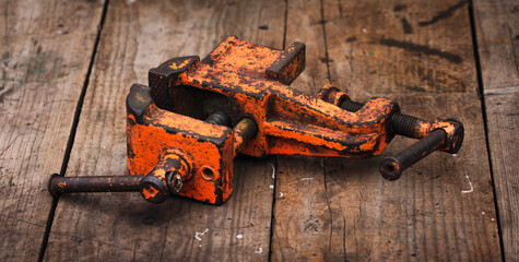 Wall Mural - Old vintage vise covered with orange paint