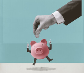 Businessman putting a coin in a piggy bank