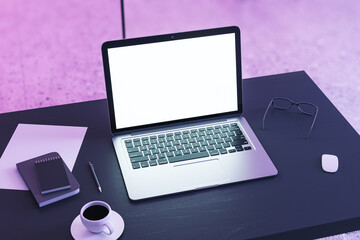 Poster - Top perspective view on blank white modern laptop screen with place for web design or landing page on dark work table with coffee cup and office tools on purple wall background. 3D rendering, mockup