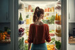 Rear view of beautiful young woman opening fridge (Generative AI)
