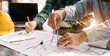 © NINENII - Team architect or engineer working on table use drawing tool on the paper plan.
