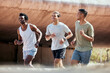 © T Mdlungu/peopleimages.com - Fitness, running and friends in a city for training, exercise and marathon practice on urban background. Diversity, workout and men group outdoor for wellness, bond and sport, conversation and cardio