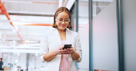 Aufkleber - Business woman in office walking with smartphone for Seoul, global or international networking, communication and marketing. Happy asian employee using phone or cellphone in a corporate workspace