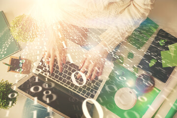 Fototapete - Double exposure of woman hands working on computer and data theme hologram drawing. Top View. Technology concept.