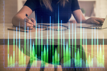 Poster - Double exposure of businesswoman hands typing on computer and forex chart hologram drawing. Financial analysis concept.