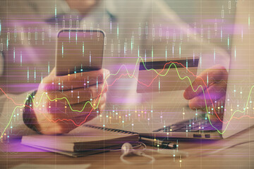 Poster - Double exposure of man hands holding a credit card and Forex graph drawing. Stock trading and digital fintech in Internet E-commerce concept.