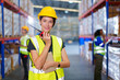 © DG PhotoStock - Happy cheerful caucasian white female warehouse worker checking an items or stock inventory in warehouse. Professional occupation in logistic industrial concept.
