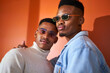 © Caia Image - Portrait confident, cool young gay male couple in sunglasses