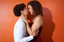 Portrait Happy Lesbian Couple With Curly Hair Smiling Face To Face