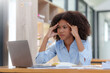 © amnaj - Asian businesswoman stressed with overwork in the office