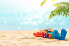 Summer Holiday Background With Flip Flops And Palm Tree On Sandy Beach