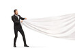 © Ljupco Smokovski - Businessman pulling a big white cloth