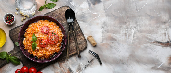 Wall Mural - Plate with tasty tomato risotto on grunge background with space for text