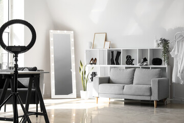 Sticker - Interior of light makeup room with mirror, shelving unit and sofa