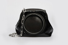 Round Black Glossy Shiny Leather Handbag Isolated On White Background. Lacquer Shoulder Bag With Chain Strap For Women. Front View. Mock Up, Template