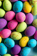 Image of multi coloured easter eggs on blue background