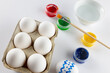 Image of easter eggs, paintbrush and paints with copy space on white background