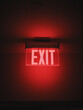 Hallway exit sign vibrant in corridor showing evacuation during emergency neon