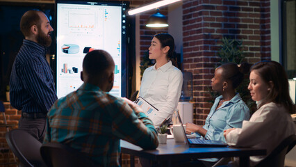 Poster - Coworkers greeting colleagues, giving corporate presentation in business meeting. Strategy planning, financial analytics report discussion, company research statistics visualization. Tripod shot.