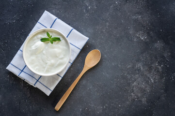 Wall Mural - Homemade Yogurt with cream in bowl on rustic table, healthy food