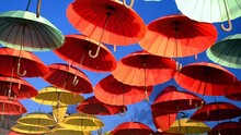 Rainbow Red And Yellow Umbrella Heap On Blue Sky In Sunny Day, Multicolor Parasol Diversity