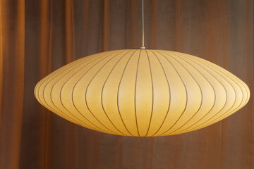 1952 Large Saucer Bubble Pendant Lamp. Mid-Century Modern lighting. Cream beige hanging lamp with curtains.