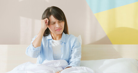 Wall Mural - woman has headache on bed