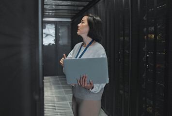 Leinwandbilder - Woman with laptop, server room and information technology, engineer and datacenter with software update. Tech industry, cybersecurity and network with Asian female setting up firewall and database