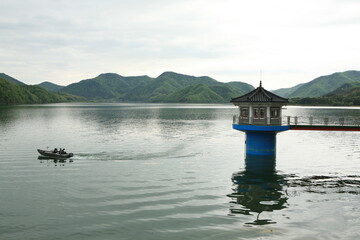 people fishing in the lake