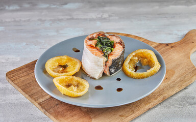 Sticker - Salmon with spinach and baked lemon and sauce. French gourmet cuisine