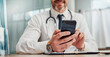 © Coetzee/peopleimages.com - Healthcare, hospital and hands of doctor with phone for social media, research and online consulting. Communication, insurance and man with smartphone for wellness app, medical data and telehealth