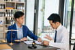 © laddawan - Two lawyers are discussing about contract paper, law matters determination, pointing.law and hammer on the table