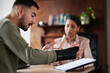 © Courtney H/peopleimages.com - Legal labor law, injury or man with lawyer woman planning on documents for insurance, compliance and HR agreement. Consulting, advisor and male client for security claim or disability compensation