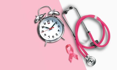 Canvas Print - Breast cancer concept. Pink ribbon and retro clock with stethoscope