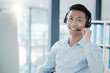 © Wesley JvR/peopleimages.com - Consultant, portrait and asian man at call center support office in Hong Kong with happy smile. Professional customer service communication employee in online consulting workspace with headset.