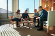 © Flamingo Images - Diverse group of smiling businesspeople meeting in an office together