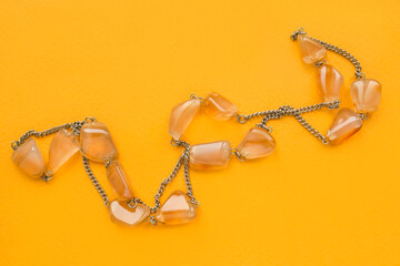 Poster - Amber necklace on yellow