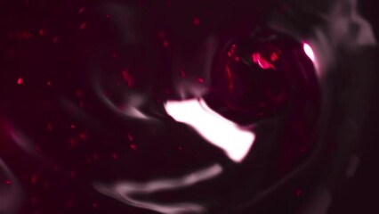 Poster - Abstract funnel quickly rushing into deep in cherry liquid with many suspended grains and moving surface reflections. Motion design abstraction on a dark background