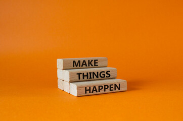 Wall Mural - Make things happen symbol. Concept word Make things happen on wooden blocks. Beautiful orange background. Business and Make things happen concept. Copy space