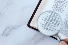 Magnifying Glass Over Open Holy Buble Book Of Psalms 139 Verses. Top Table View. Copy Space. Searching, Examining, And Studying Old Testament Scriptures, Christian Biblical Concept.