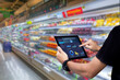 © panuwat - Smart retail management system.Worker hands holding tablet on blurred supermartket as background