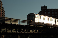 Bronx New York Silver Elevated Subway 6 Train Reflecting The Early Morning Sunlight