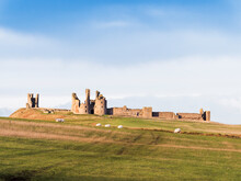 Dunstanburgh Castle On The Northumberland Coast With Copy Space