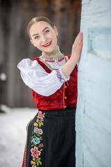 Young beautiful slovak woman in traditional costume. Slovak folklore