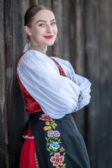 Young beautiful slovak woman in traditional costume. Slovak folklore