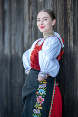 Young beautiful slovak woman in traditional costume. Slovak folklore