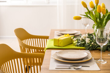 Wall Mural - Table setting for International Women's Day celebration with gifts and tulip flowers in light room