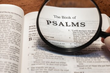 title page book of Psalms close up using magnifying glass in the bible or Torah for faith, christian, hebrew, israelite, history, religion, christianity, Old Testament